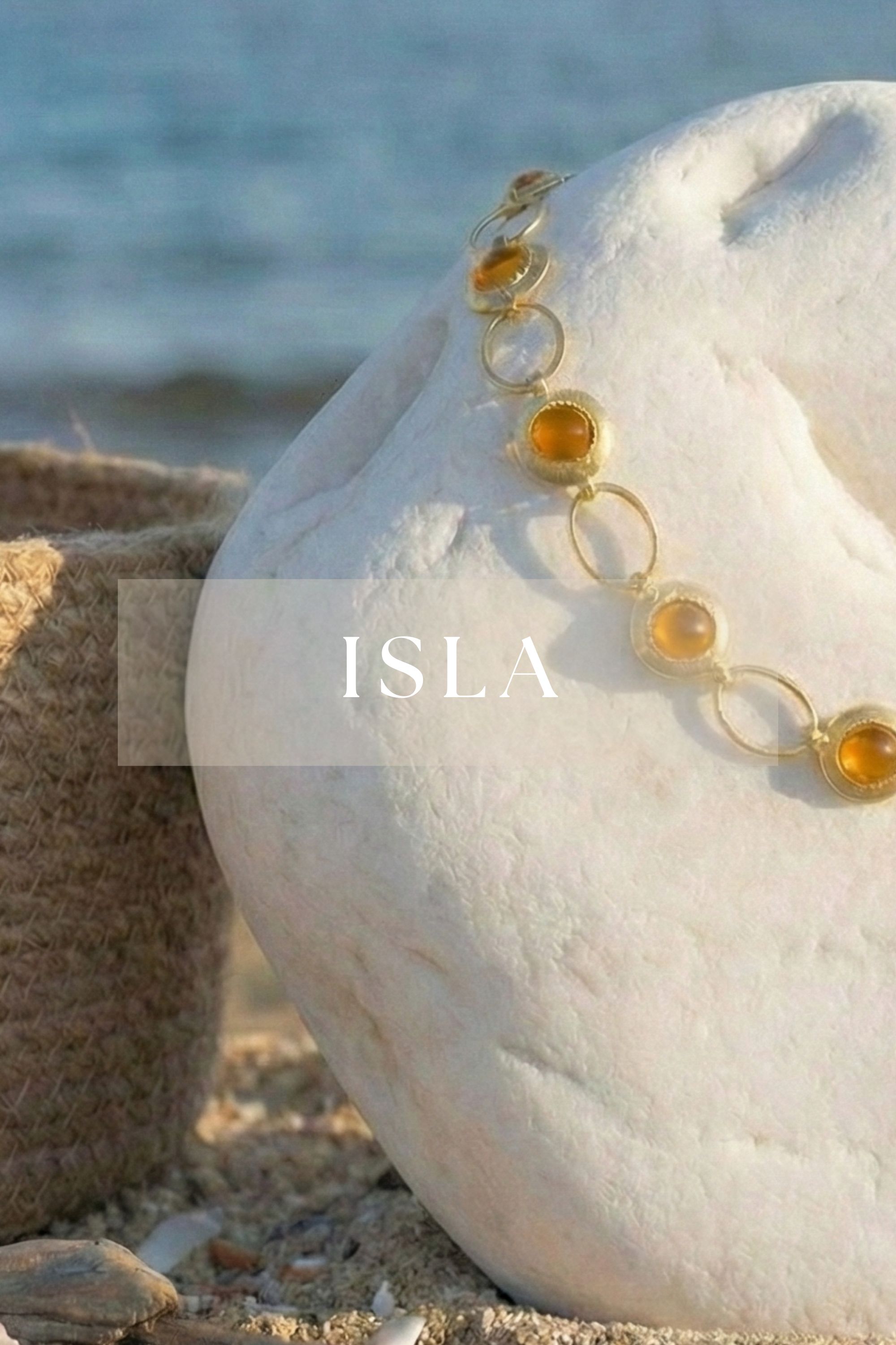 Paisaje costero Isla Cantabria joyas tonos ámbar y dorado colección Amanai